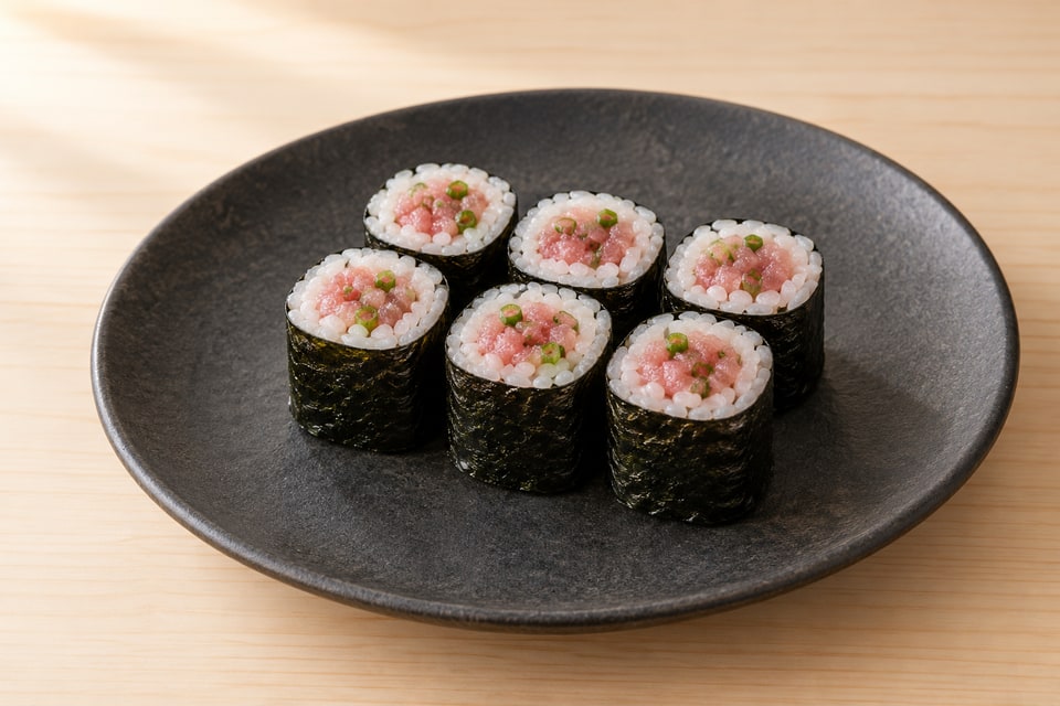 Negitoro maki with finely chopped fatty tuna and scallion in a nori-wrapped roll. — AI recipe illustration